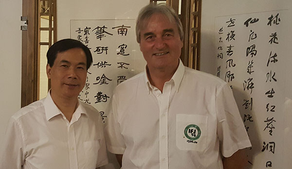 Peter Schrein (Institute for Youth Soccer) with Wang Jianxin (Director of Education in Yiwu)